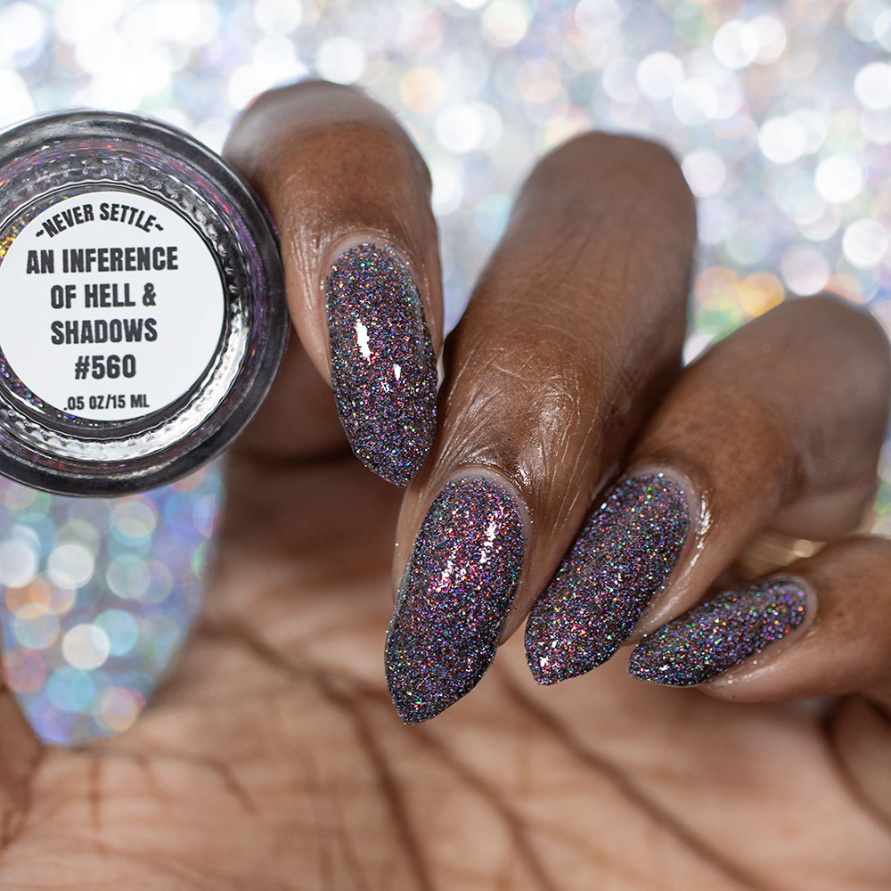 red sparkles with lavender reflective glitter in a dark base over nails holding bottle that says an inference of hell and shadows