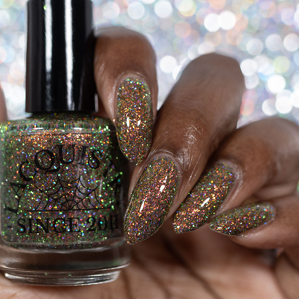 nails painted with sparkly glittery polish showing pink, red, green, gold and orange glitters in a darkened base color with green reflective glitter